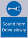 sound-horn-drive-slowly-warehousing-and-delivery-sign~